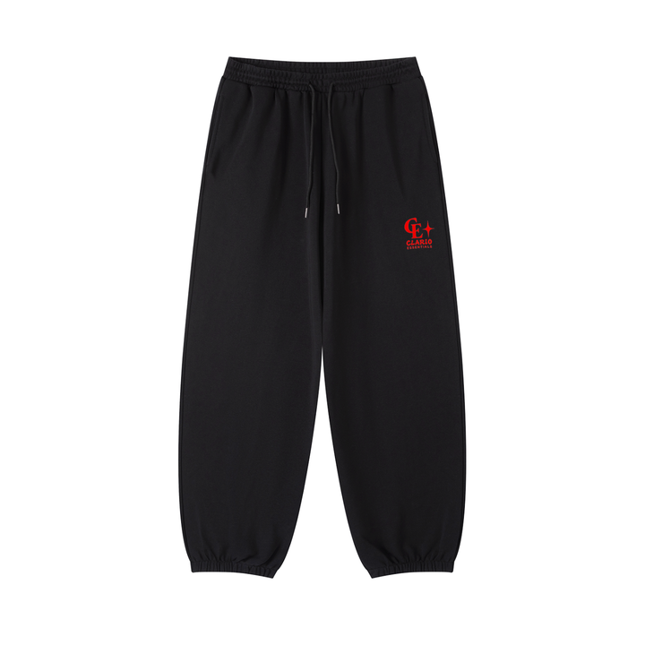 Black jogger sweatpants with an elastic waistband, drawstring, and elastic cuffs, featuring a small red embroidered logo on the left thigh.